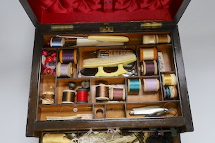 A Victorian walnut sewing casket with concealed spring loaded writing slope, 33.5cms wide x 23cms high